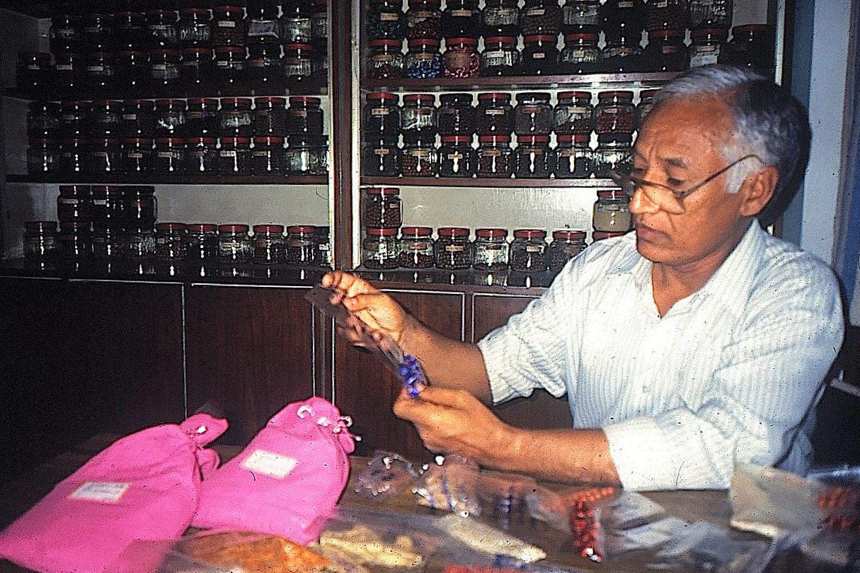 Dr. Tashigang holding precious pills